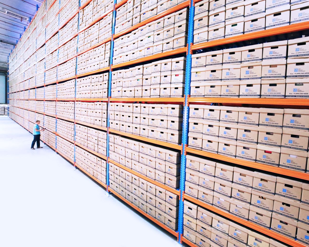 boxes of documents stacked in a warehouse